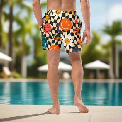 Smiley Face Checkerboard Mens Recycled Swim Trunks Family Matching Swim Wear Groovy Style Bathing Suit. These swim trunks feature a retro smiley face checkerboard pattern, with flowers and rainbows by jaecrece.com