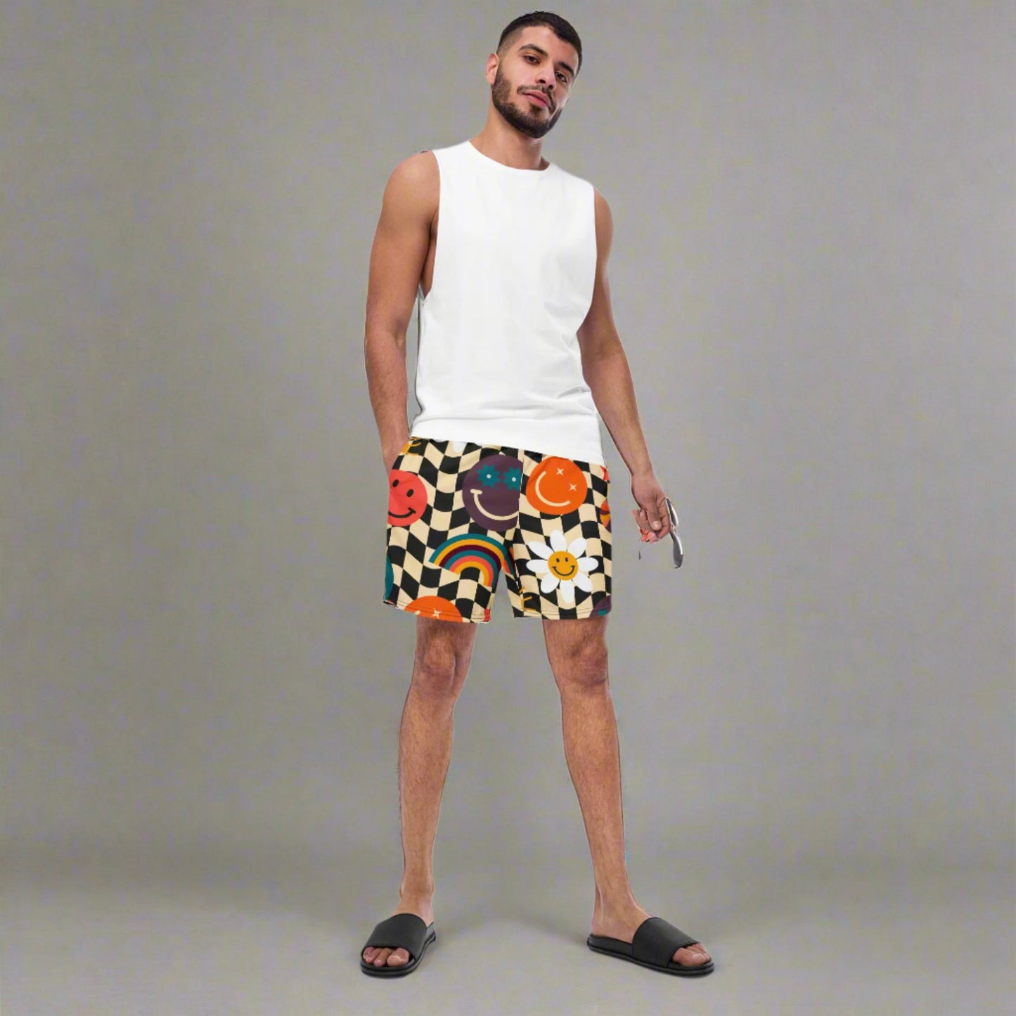 Smiley Face Checkerboard Mens Recycled Swim Trunks Family Matching Swim Wear Groovy Style Bathing Suit. These swim trunks feature a retro smiley face checkerboard pattern, with flowers and rainbows by jaecrece.com