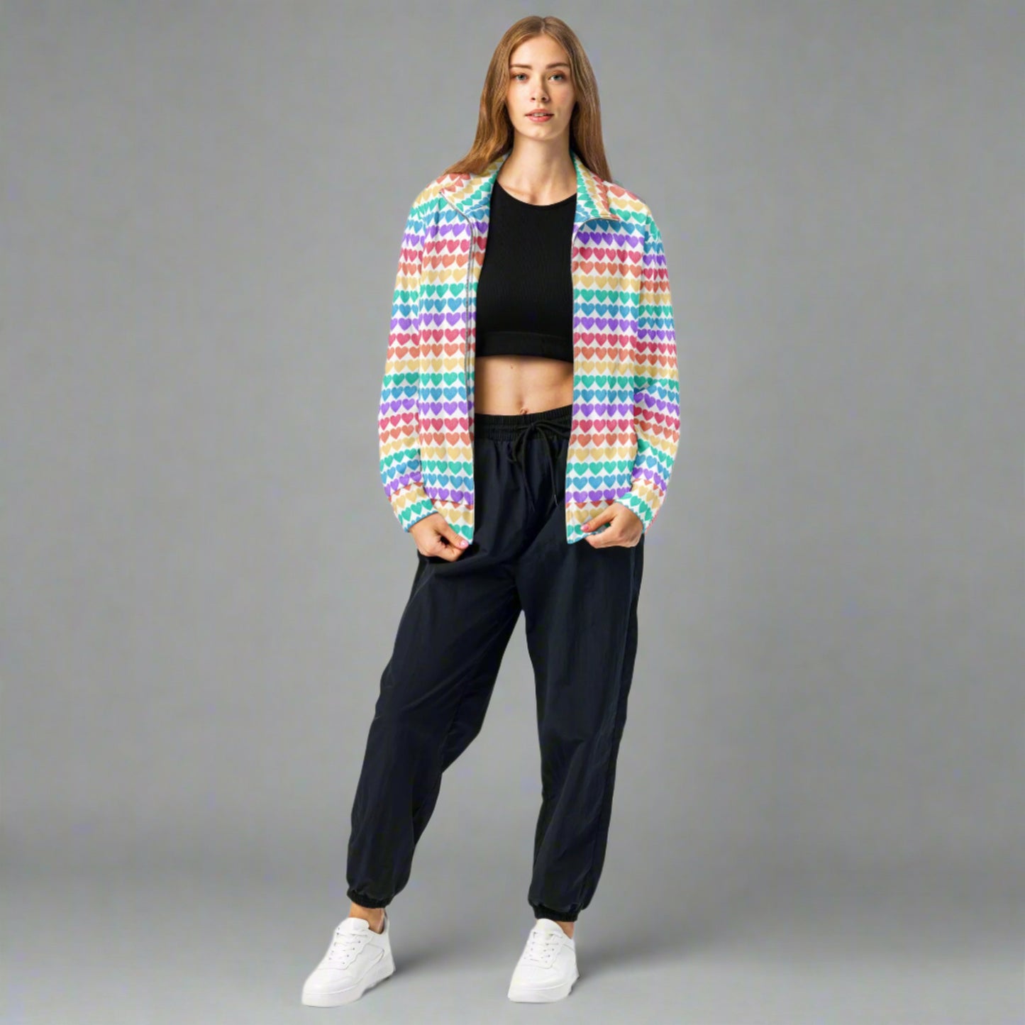 Image: Rainbow Hearts Unisex Track Jacket. This lightweight athletic coat has rows of hearts in the color of the rainbow. Great active wear jacket for Valentines Day or LGBTQ Pride parades, by jaecrece