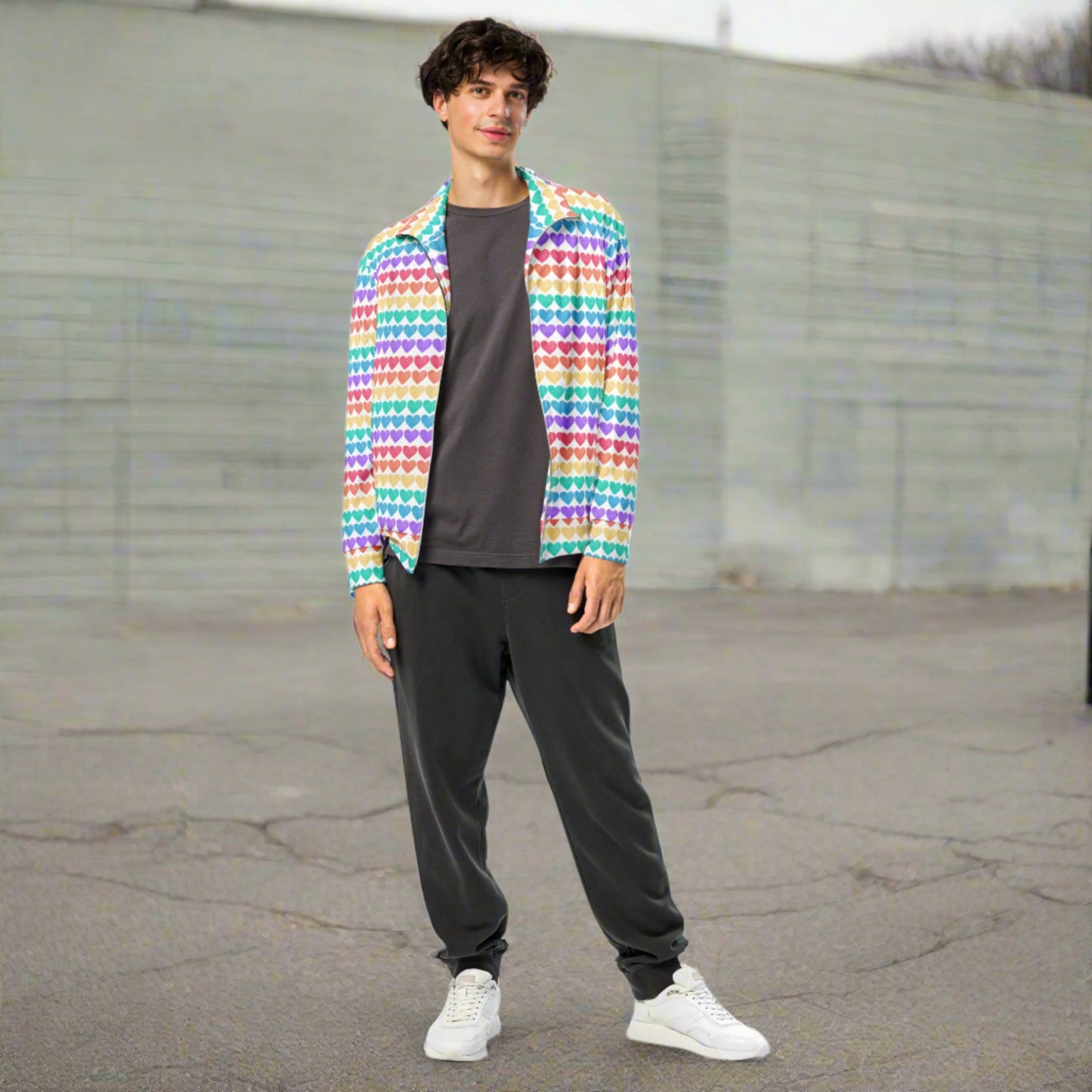 Image: Rainbow Hearts Unisex Track Jacket. This lightweight athletic coat has rows of hearts in the color of the rainbow. Great active wear jacket for Valentines Day or LGBTQ Pride parades, by jaecrece