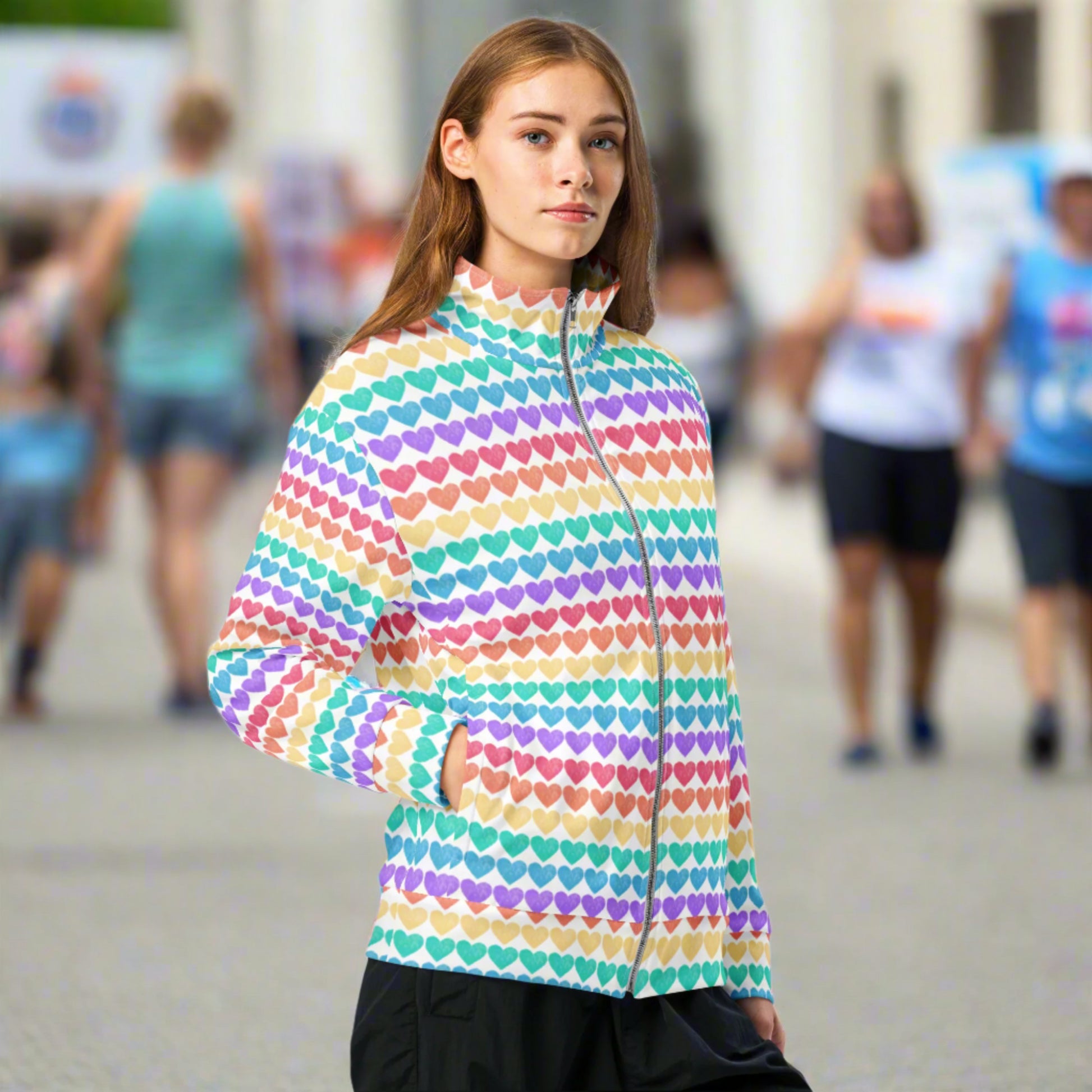 Image: Rainbow Hearts Unisex Track Jacket. This lightweight athletic coat has rows of hearts in the color of the rainbow. Great active wear jacket for Valentines Day or LGBTQ Pride parades, by jaecrece