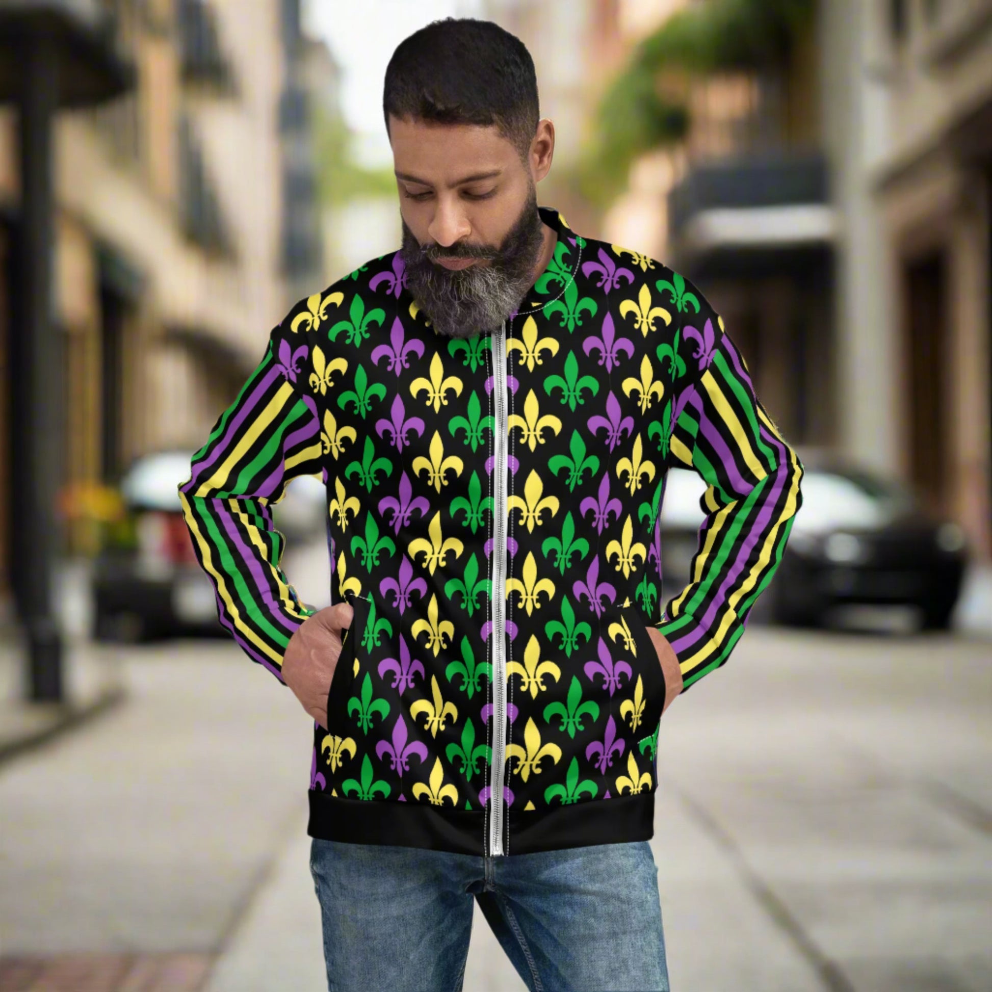 Image: Mardi Gras Unisex Bomber Jacket. This lightweight NOLA apparel is perfect for parades in the French Quarter, or Mardi Gras themed fun runs. It features a gold, green and purple fleur de lis pattern on the front and back, with gold, purple and green stripes going down each arm. Plus sizes available, by jaecrece