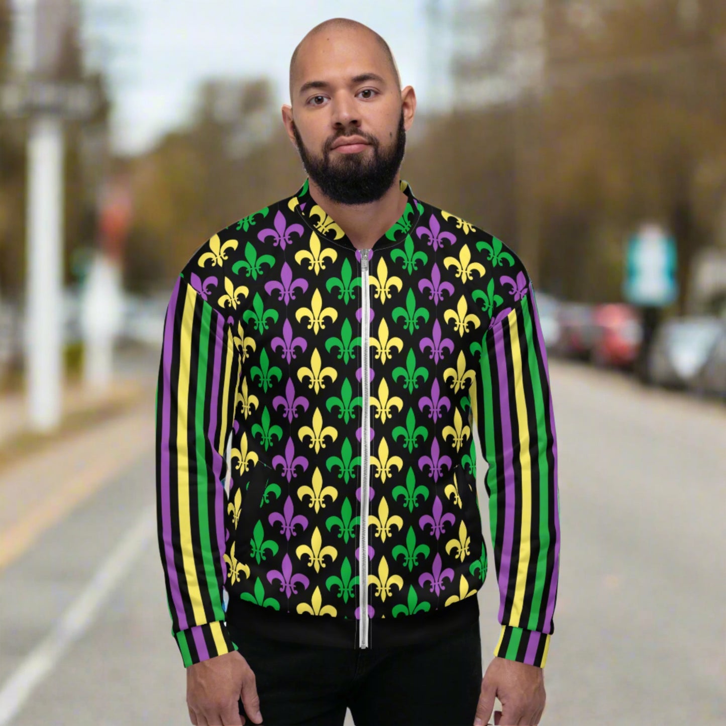 Image: Mardi Gras Unisex Bomber Jacket. This lightweight NOLA apparel is perfect for parades in the French Quarter, or Mardi Gras themed fun runs. It features a gold, green and purple fleur de lis pattern on the front and back, with gold, purple and green stripes going down each arm. Plus sizes available, by jaecrece