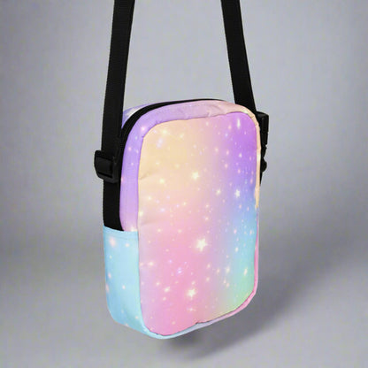 Image: canvas utility small crossbody bag: pink purple blue star pattern, with a fairy tale mythical unicorn. Whimsical Birthday or Christmas Gift for girls or tweens. May be worn as a sling, on hips or waist. Fanny pack or mini backpack, by jaecrece