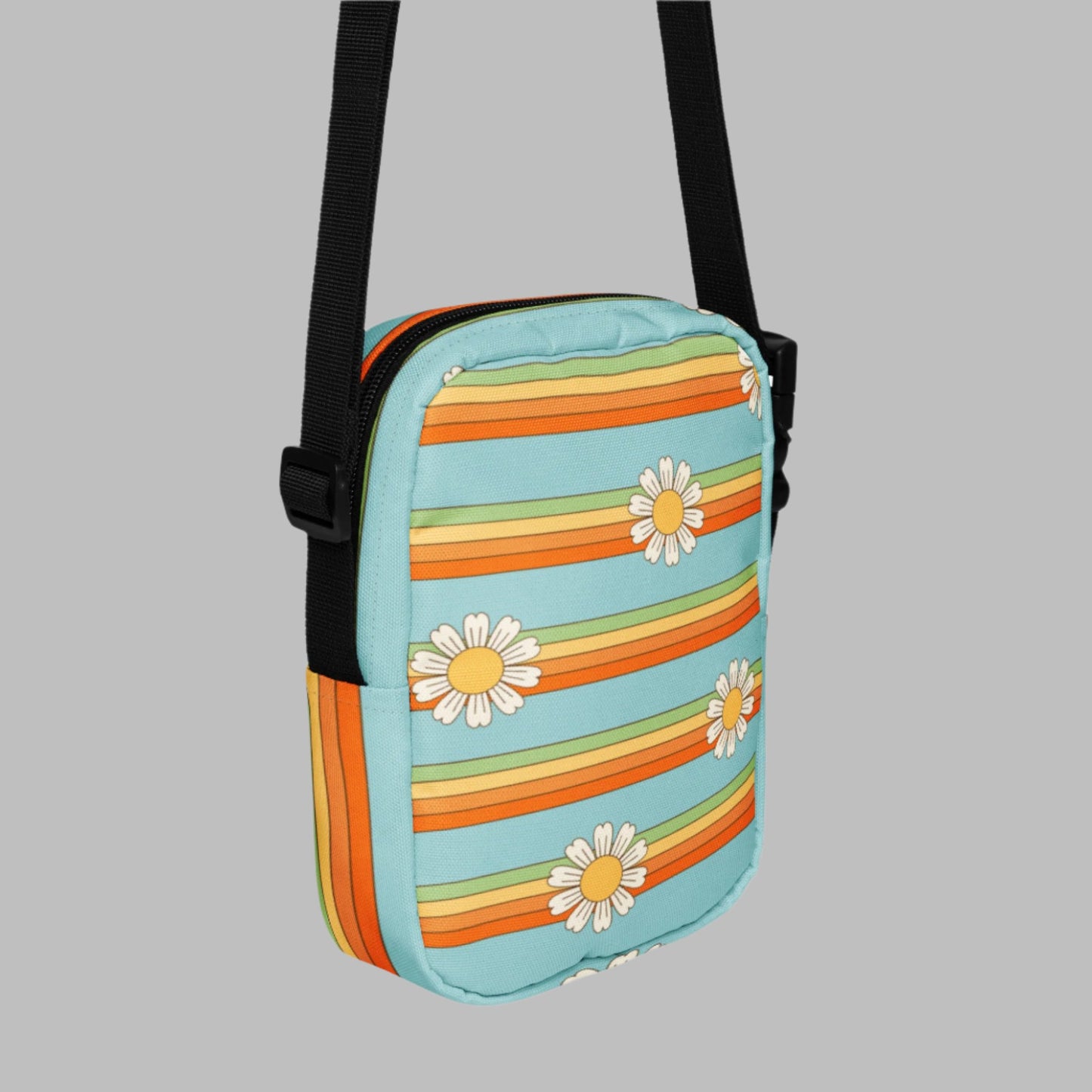 Rainbow & Daisy Canvas Utility Crossbody bag is light blue, with a retro rainbow and daisy pattern. With two storage pockets and a two way zipper, this small tote is perfect for adventures, by jaecrece