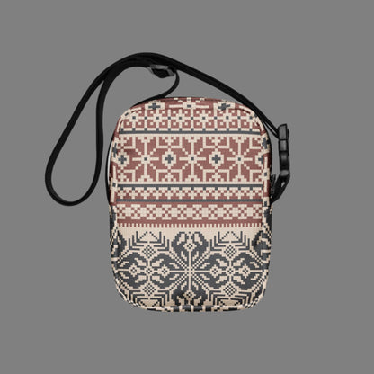 Image: Fair Isle Crossbody Bag. This small canvas tote has a Scandanavian geometric pattern of snowflakes in maroon and navy blue. It may be worn across the hips, waist, chest or as a mini backpack, by jaecrece