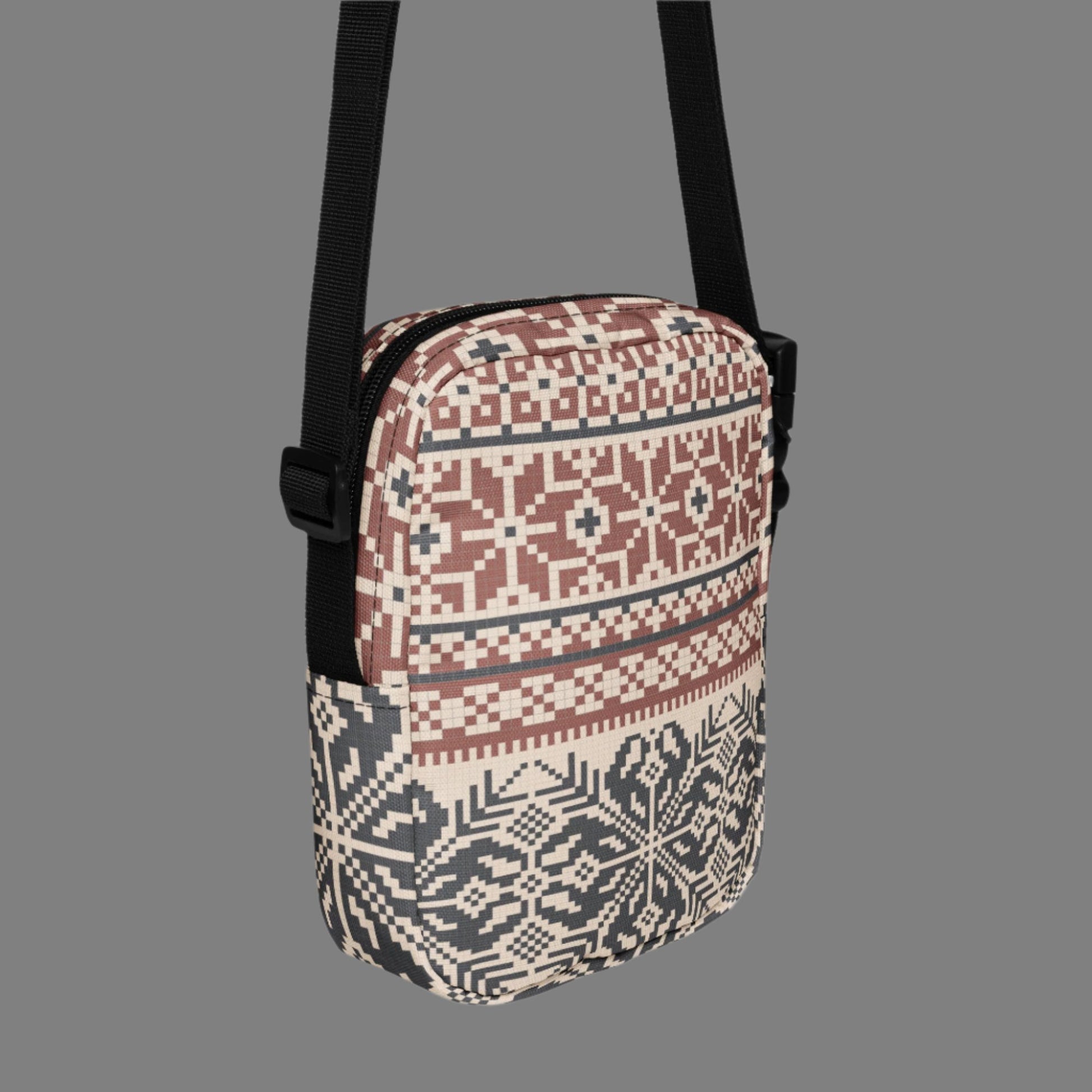 Image: Fair Isle Crossbody Bag. This small canvas tote has a Scandanavian geometric pattern of snowflakes in maroon and navy blue. It may be worn across the hips, waist, chest or as a mini backpack, by jaecrece