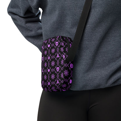 Our Wickedly Cute Halloween Crossbody Utility Bag is made with black water resistant canvas, and features an adorable Halloween themed purple pattern of spider webs, skulls, witch hats and pumpkins. These make a perfect gift for adults, teens and tweens. by jaecrece.com