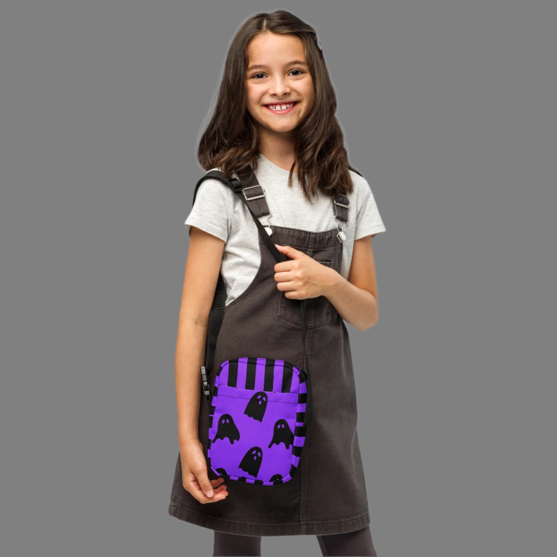 Cute Ghost Small Canvas Crossbody Bag, Ghost and Black Stripes Halloween Utility Bag, This bag has a strap that may be worn crossbody, or on hips/ waist. This purple and black water resistant fanny pack can be used as a camera or cell phone holder, by jaecrece