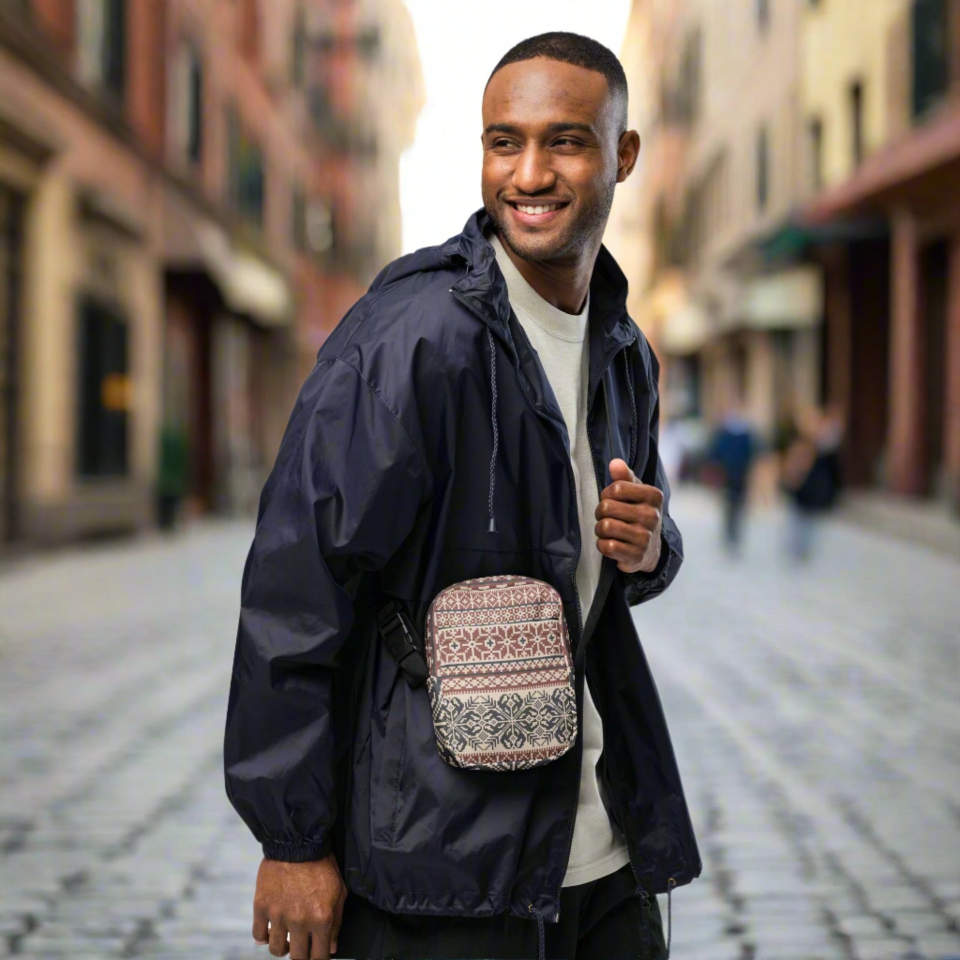 Image: Fair Isle Crossbody Bag. This small canvas tote has a Scandanavian geometric pattern of snowflakes in maroon and navy blue. It may be worn across the hips, waist, chest or as a mini backpack, by jaecrece