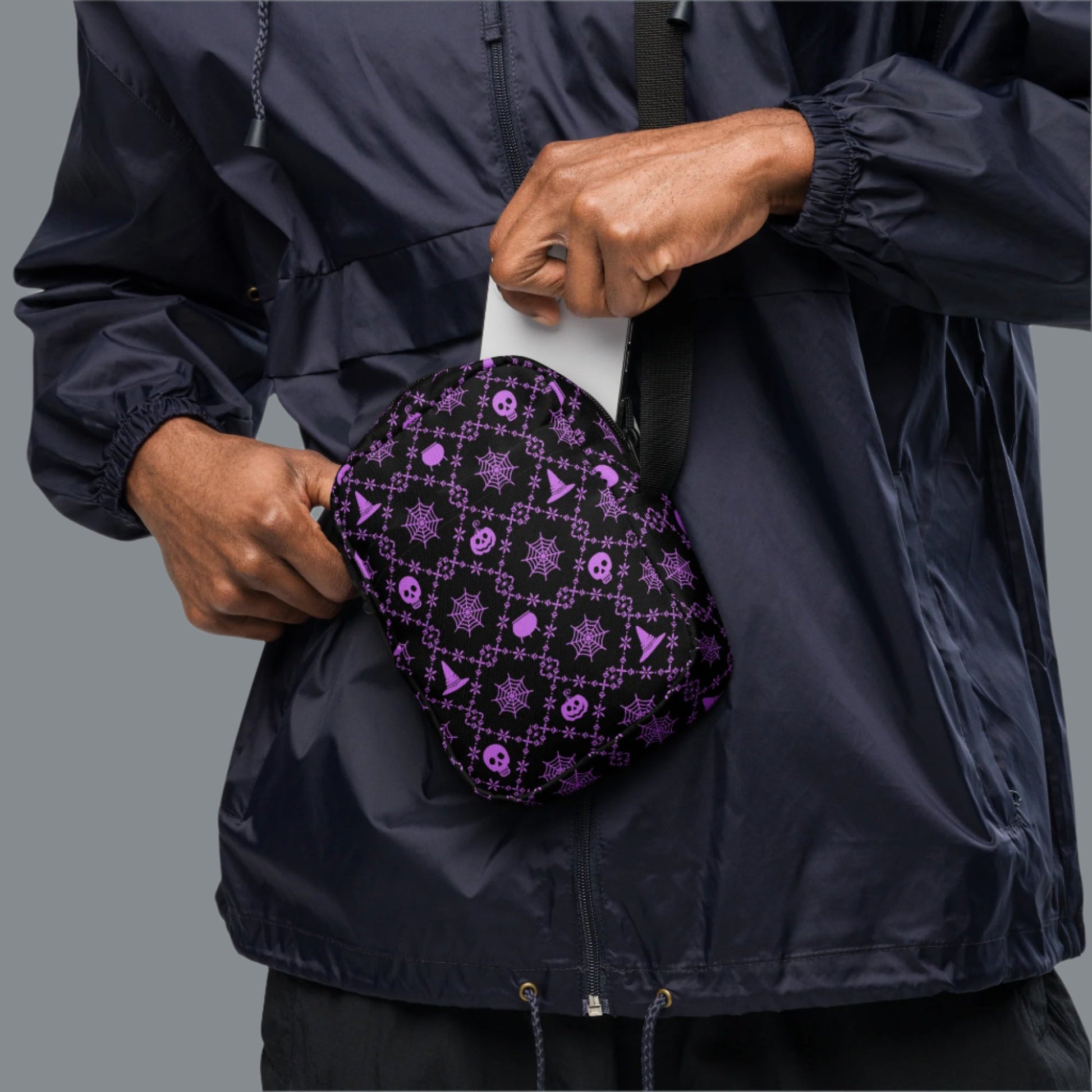 Our Wickedly Cute Halloween Crossbody Utility Bag is made with black water resistant canvas, and features an adorable Halloween themed purple pattern of spider webs, skulls, witch hats and pumpkins. These make a perfect gift for adults, teens and tweens. by jaecrece.com