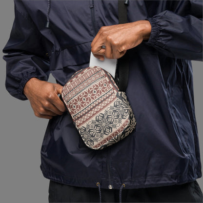 Image: Fair Isle Crossbody Bag. This small canvas tote has a Scandanavian geometric pattern of snowflakes in maroon and navy blue. It may be worn across the hips, waist, chest or as a mini backpack, by jaecrece