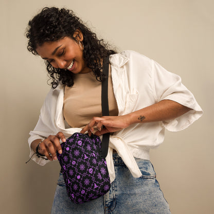 Our Wickedly Cute Halloween Crossbody Utility Bag is made with black water resistant canvas, and features an adorable Halloween themed purple pattern of spider webs, skulls, witch hats and pumpkins. These make a perfect gift for adults, teens and tweens. by jaecrece.com