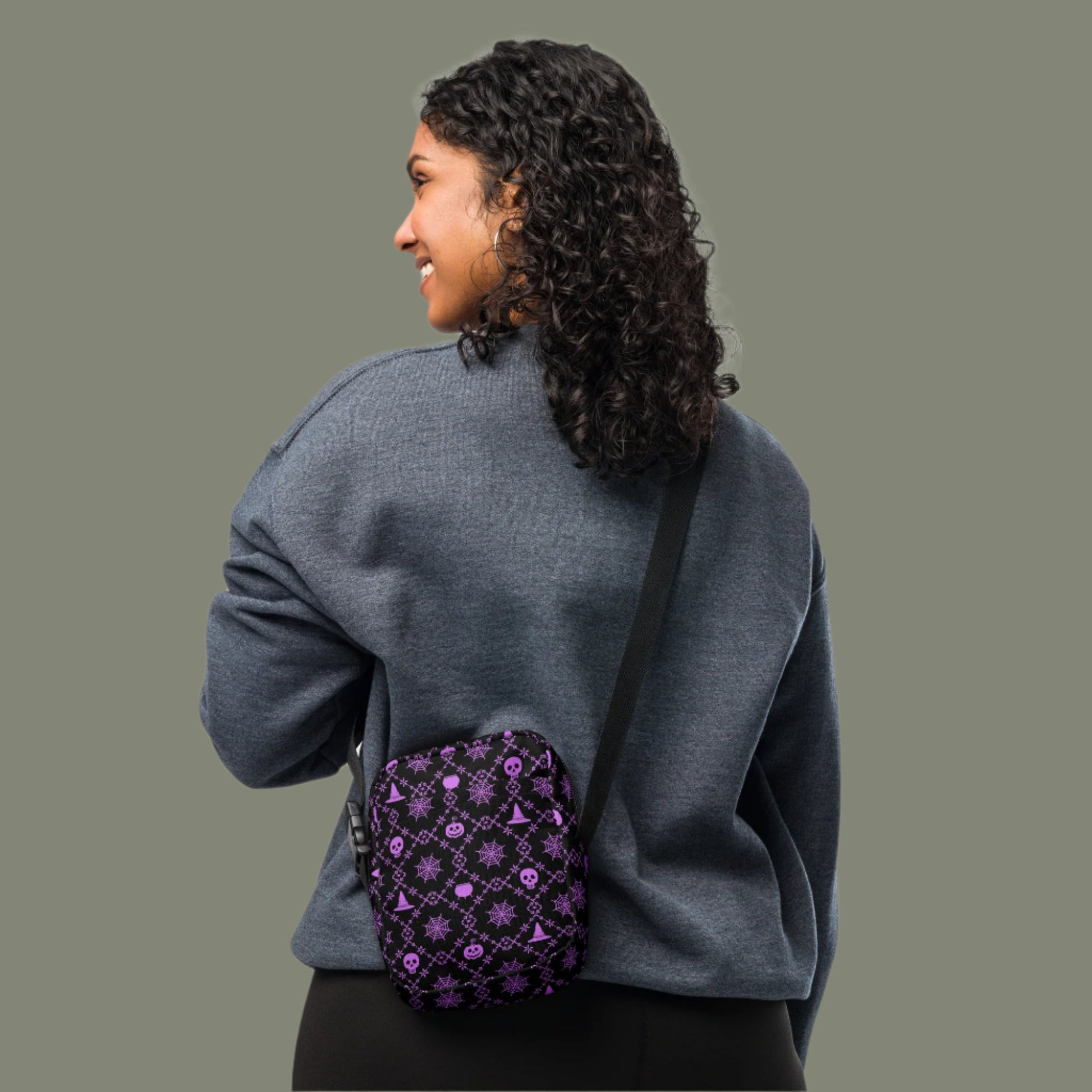 Our Wickedly Cute Halloween Crossbody Utility Bag is made with black water resistant canvas, and features an adorable Halloween themed purple pattern of spider webs, skulls, witch hats and pumpkins. These make a perfect gift for adults, teens and tweens. by jaecrece.com