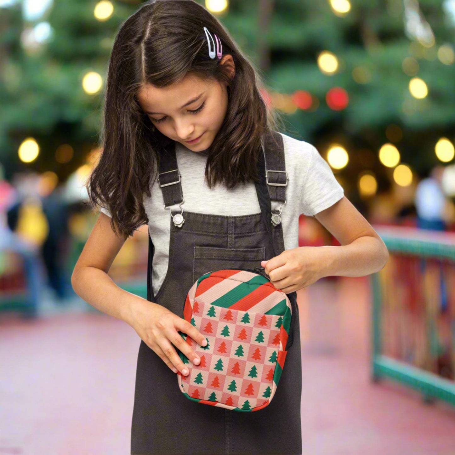 Our red and pink christmas tree utility crossbody bag has a pink and red checker pattern with xmas trees on the front and back. The sides of this small canvas tote are red, pink and green candy cane stripes. This mini backpack is perfect for parades, hiking, biking or anywhere you need to be hands free. Makes a great holiday gift for girls, moms, teens or tweens, by jaecrece