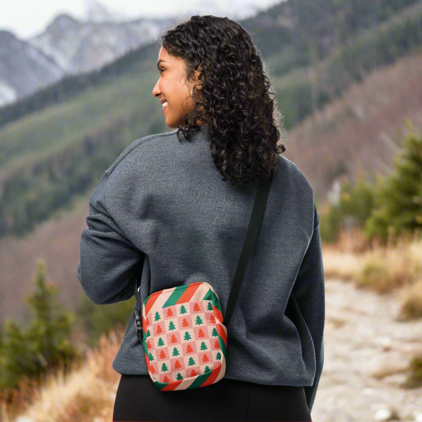 Our red and pink christmas tree utility crossbody bag has a pink and red checker pattern with xmas trees on the front and back. The sides of this small canvas tote are red, pink and green candy cane stripes. This mini backpack is perfect for parades, hiking, biking or anywhere you need to be hands free. Makes a great holiday gift for girls, moms, teens or tweens, by jaecrece