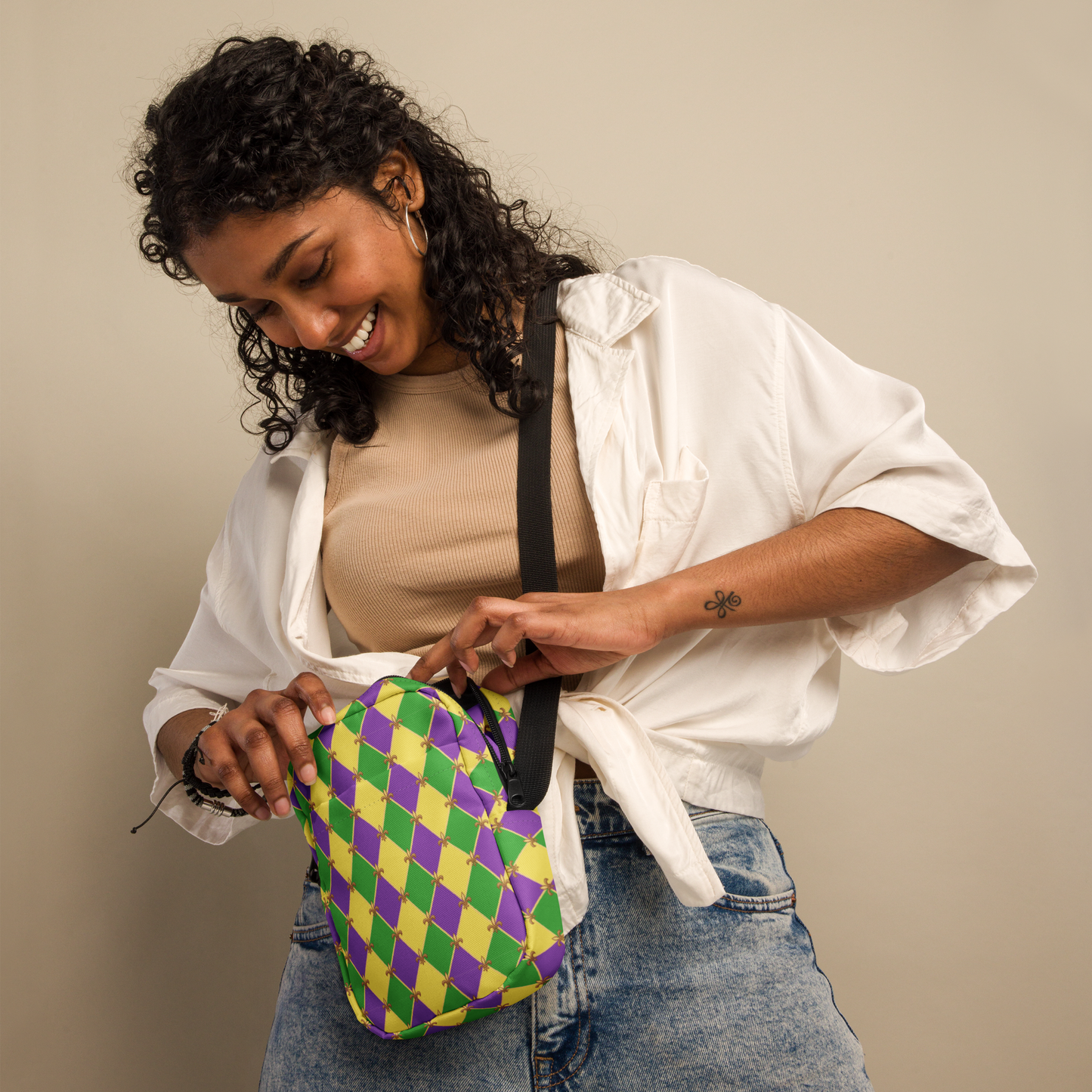 Image: Mardi Gras cross body bag. This small canvas tote is shows the Fleur de Lis on a purple, green and yellow diamond print background. It can be worn to your New Orleans carnival parade across the chest, hips or waist. The perfect fanny pack for your celebrations! by jaecrece