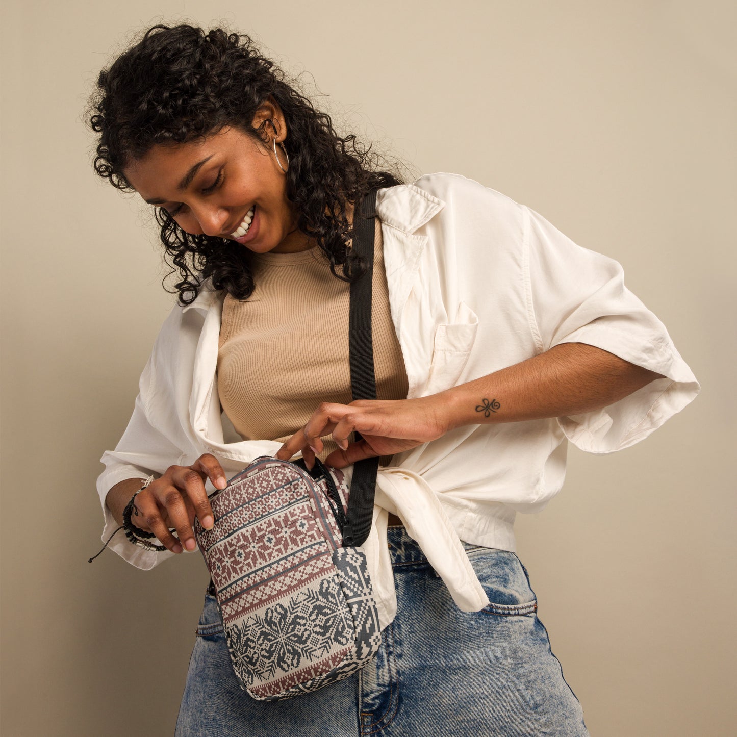 Image: Fair Isle Crossbody Bag. This small canvas tote has a Scandanavian geometric pattern of snowflakes in maroon and navy blue. It may be worn across the hips, waist, chest or as a mini backpack, by jaecrece