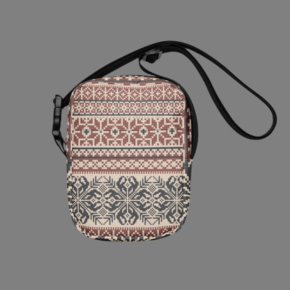 Image: Fair Isle Crossbody Bag. This small canvas tote has a Scandanavian geometric pattern of snowflakes in maroon and navy blue. It may be worn across the hips, waist, chest or as a mini backpack, by jaecrece