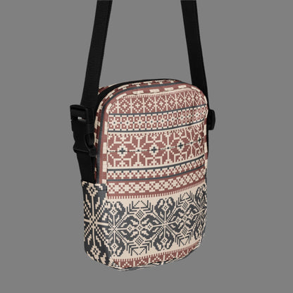 Image: Fair Isle Crossbody Bag. This small canvas tote has a Scandanavian geometric pattern of snowflakes in maroon and navy blue. It may be worn across the hips, waist, chest or as a mini backpack, by jaecrece