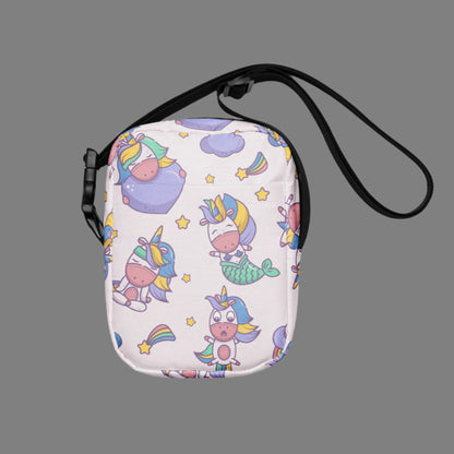 Image: Pink Unicorn Mermaid Kawaii Small Purse, this canvas crossbody has a light pink background with graphics of Unicorn mermaids, stars and rainbows. The perfect gift for tween girls, by jaecrece