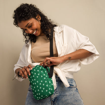 Image: St Patricks Day Fanny Pack. This green small crossbody bag is green, with a pattern of white shamrocks. Our four leaf clover small canvas tote makes a great gift for men, women, teens and kids. Its a great hands free pouch for your camera and phone at Irish festivals and St Pattys Day parades, by jaecrece