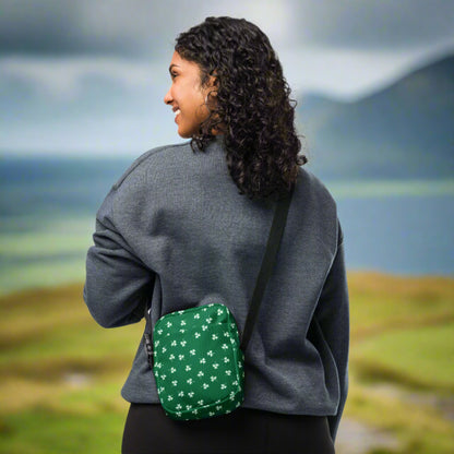 Image: St Patricks Day Fanny Pack. This green small crossbody bag is green, with a pattern of white shamrocks. Our four leaf clover small canvas tote makes a great gift for men, women, teens and kids. Its a great hands free pouch for your camera and phone at Irish festivals and St Pattys Day parades, by jaecrece