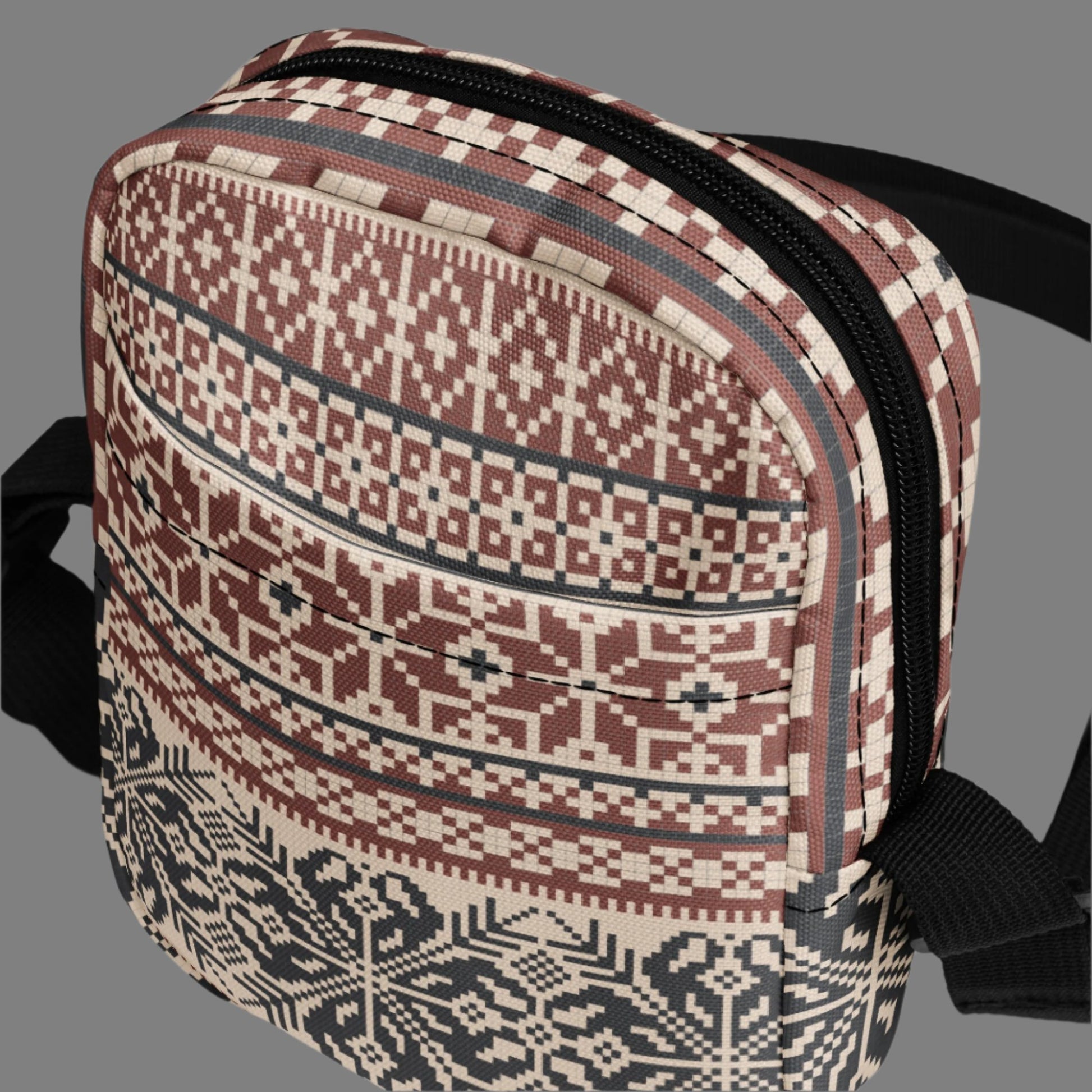 Image: Fair Isle Crossbody Bag. This small canvas tote has a Scandanavian geometric pattern of snowflakes in maroon and navy blue. It may be worn across the hips, waist, chest or as a mini backpack, by jaecrece