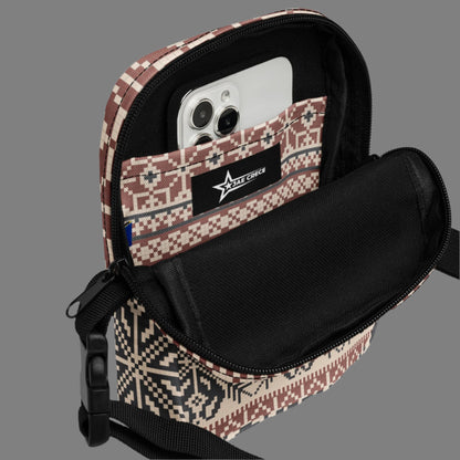 Image: Fair Isle Crossbody Bag. This small canvas tote has a Scandanavian geometric pattern of snowflakes in maroon and navy blue. It may be worn across the hips, waist, chest or as a mini backpack, by jaecrece