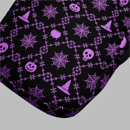 Our Wickedly Cute Halloween Crossbody Utility Bag is made with black water resistant canvas, and features an adorable Halloween themed purple pattern of spider webs, skulls, witch hats and pumpkins. These make a perfect gift for adults, teens and tweens. by jaecrece.com