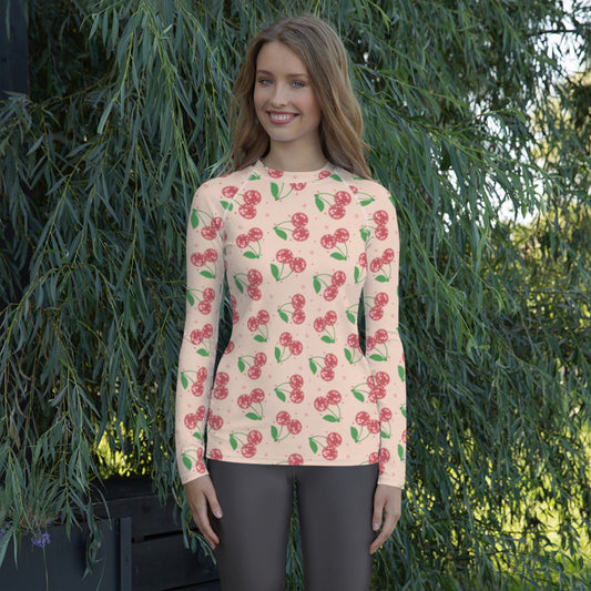 Image: Retro Cherries Womens Rash Guard. This fruit inspired swimwear is a part of our Family Matching Swimwear Collection, and features a pink background with red disco ball cherries and stars, by jaecrece