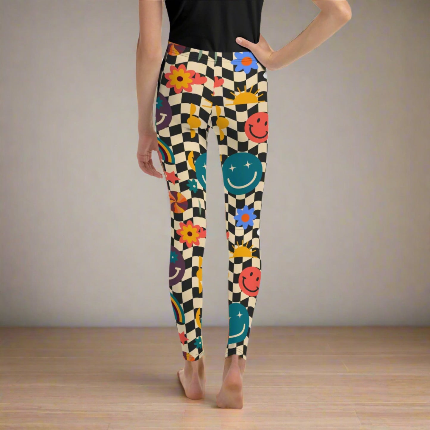 Image: Retro Checkerboard Girls Leggings, in size 8-20. These yoga pants feature a black and khaki vintage check pattern with smiley faces, daisies, rainbows and suns. These vintage tights make a great birthday present, birthday gift, and are great for back to school, by jaecrece