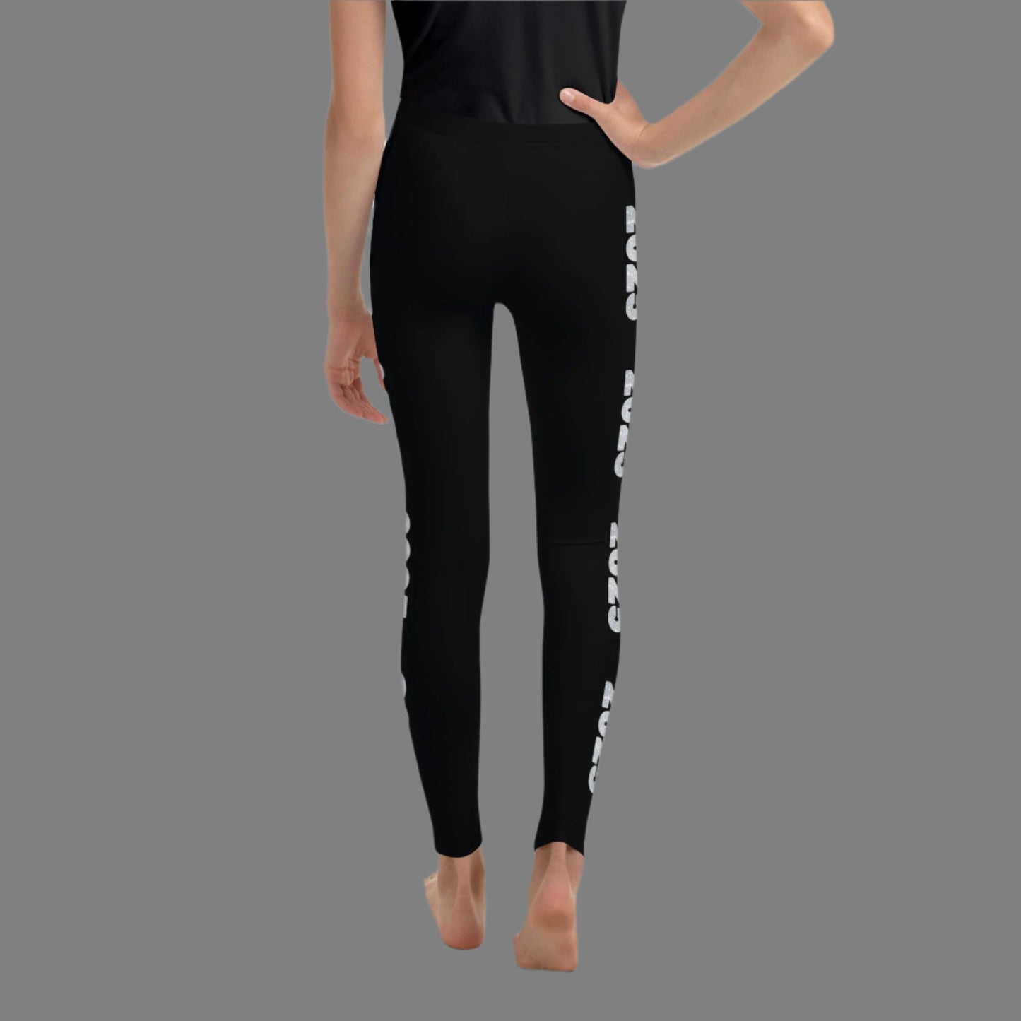 2025 Leggings for Happy New Year Party Celebration or a gift for graduating class of 2025. Black yoga pants have large repeating silver 2025 running down the outside of each leg. Tights are available in youth, tween, teen sizes 8-20, by jaecrece