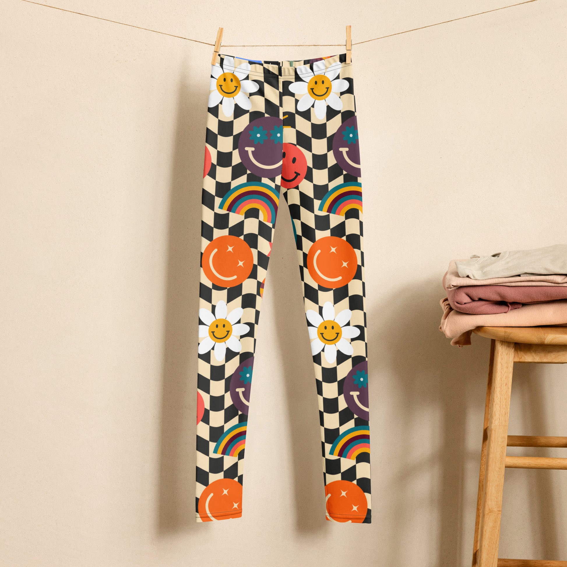 Image: Retro Checkerboard Girls Leggings, in size 8-20. These yoga pants feature a black and khaki vintage check pattern with smiley faces, daisies, rainbows and suns. These vintage tights make a great birthday present, birthday gift, and are great for back to school, by jaecrece