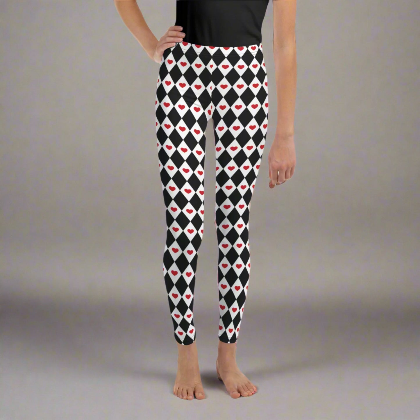 Image: Black and white harlequin check youth leggings with red heart accents. These yoga pants are designed for comfort and flexibility, by jaecrece