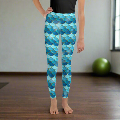 Image: Mermaid Youth Girls Leggings  feature a stunning blue scale print, perfect for tweens and teens in sizes 8-20. Perfect for girls who love the mermaid aesthetic, by jaecrece