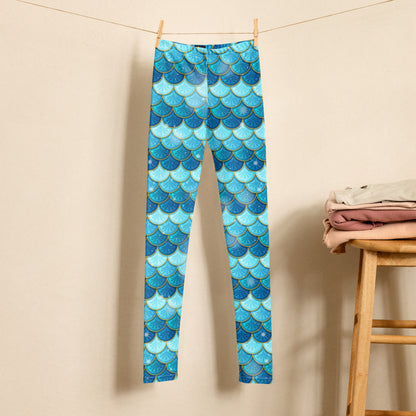 Image: Mermaid Youth Girls Leggings  feature a stunning blue scale print, perfect for tweens and teens in sizes 8-20. Perfect for girls who love the mermaid aesthetic, by jaecrece