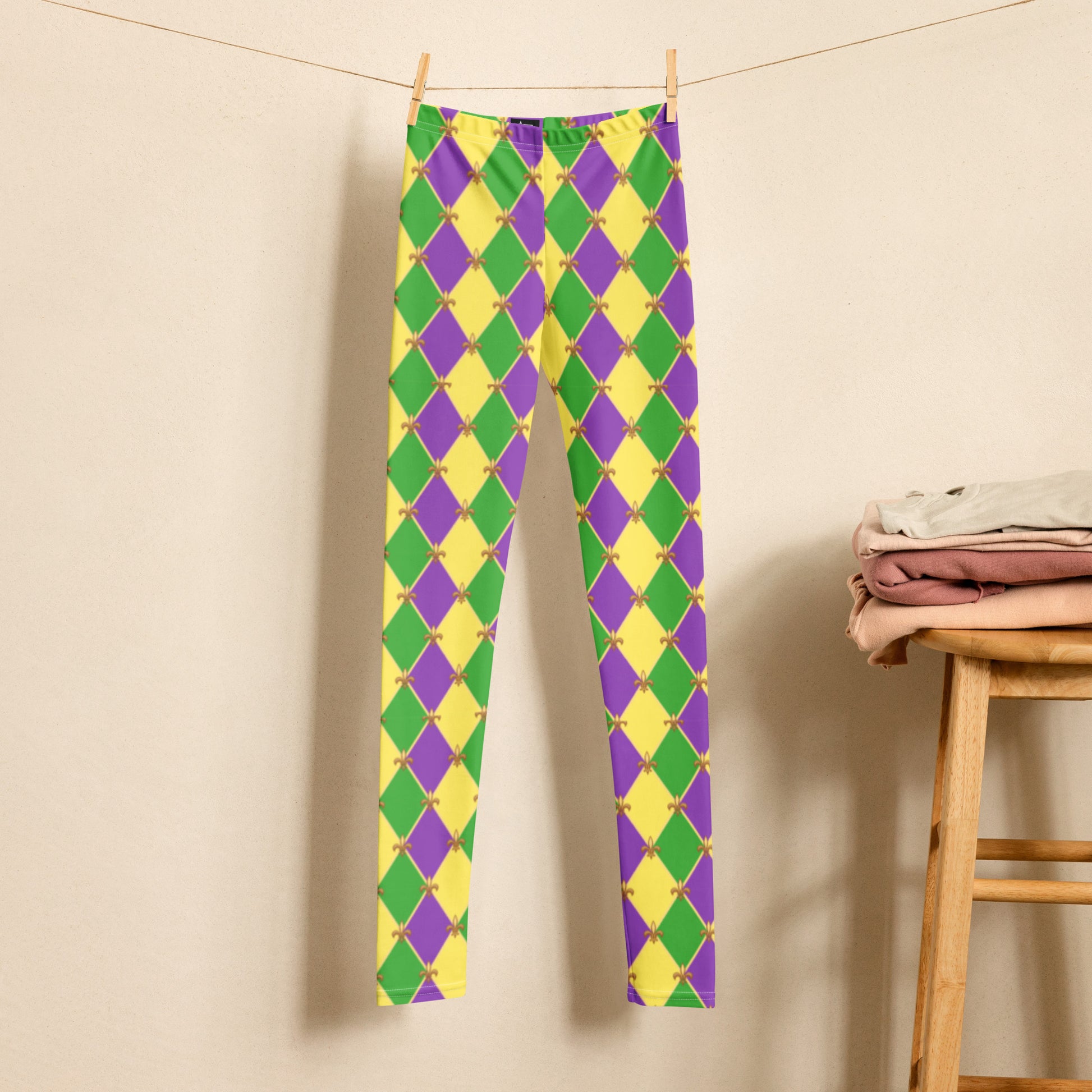 image: Youth girls harlequin diamond or checkerboard pattern leggings in purple, green and gold, with a repeating Fleur de Lis pattern, by jaecrece
Mardi Gras Leggings, Fat Tuesday Tights, teen Parade Outfit, Yoga Workout Pants, Mommy Me Match, New Orleans Tween Girl NOLA Costume