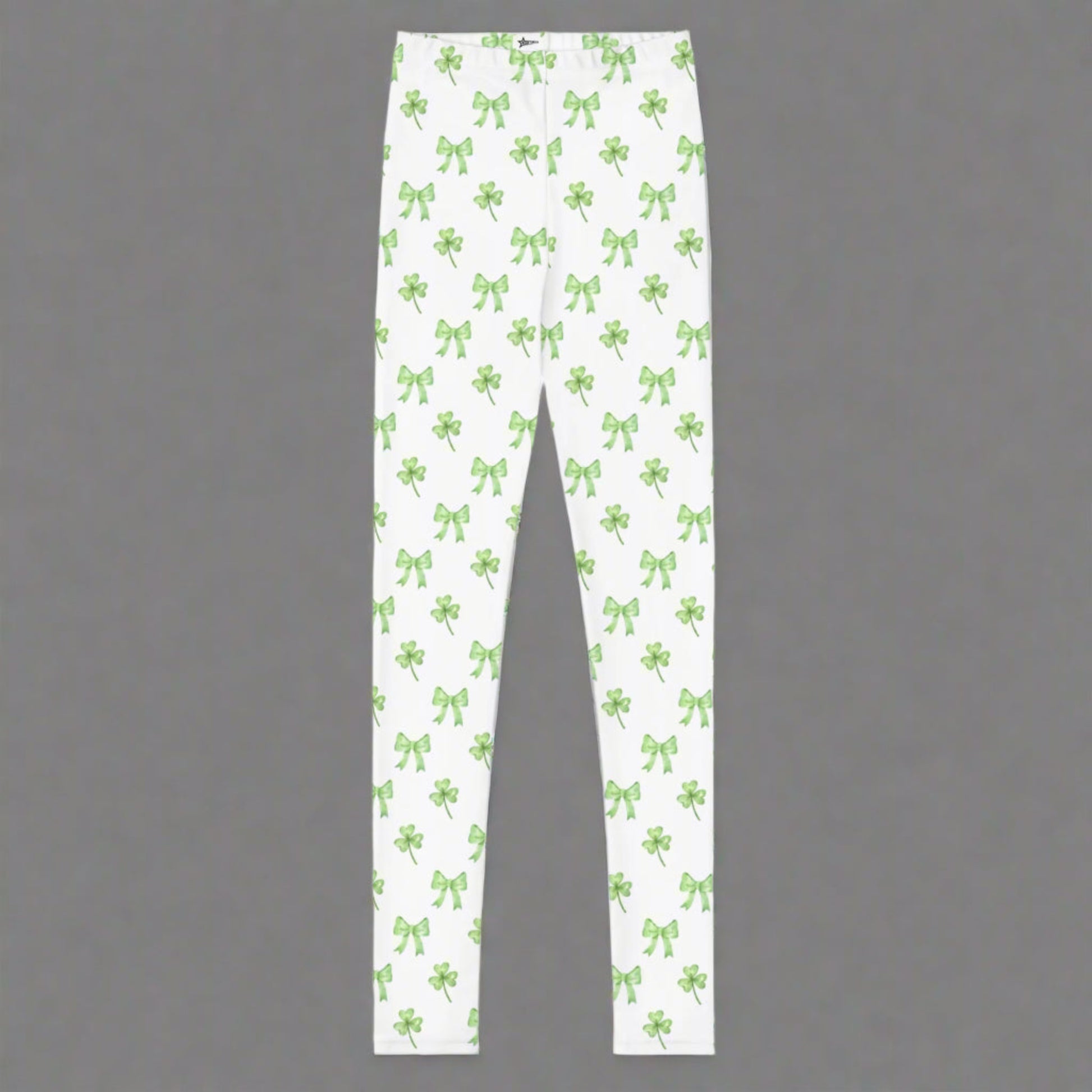 Image: St Patricks Day Leggings for toddlers, girls, tween and women. These white coquette yoga pants feature a dainty pattern of shamrocks and bows, by jaecrece