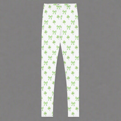 Image: St Patricks Day Leggings for toddlers, girls, tween and women. These white coquette yoga pants feature a dainty pattern of shamrocks and bows, by jaecrece