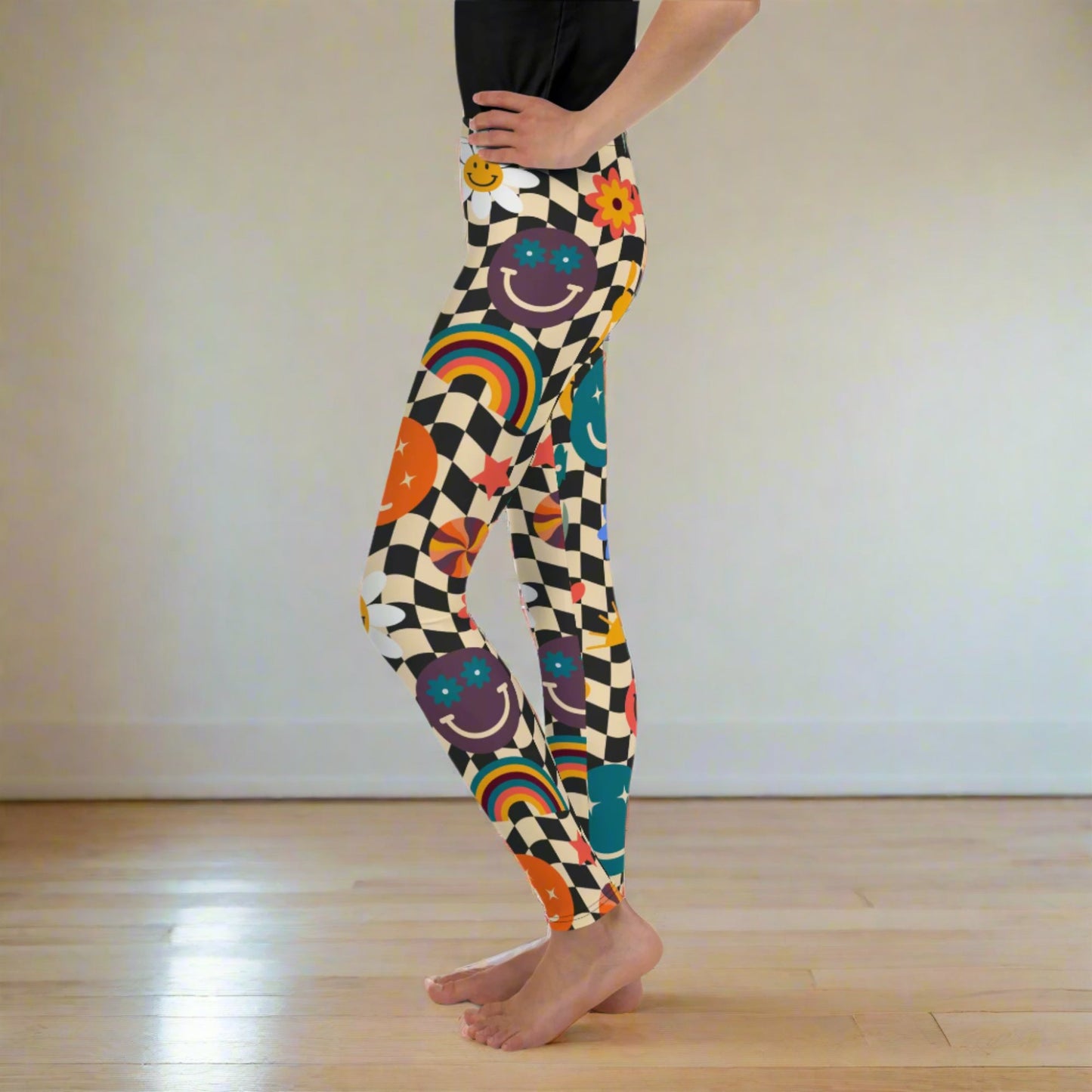 Image: Retro Checkerboard Girls Leggings, in size 8-20. These yoga pants feature a black and khaki vintage check pattern with smiley faces, daisies, rainbows and suns. These vintage tights make a great birthday present, birthday gift, and are great for back to school, by jaecrece