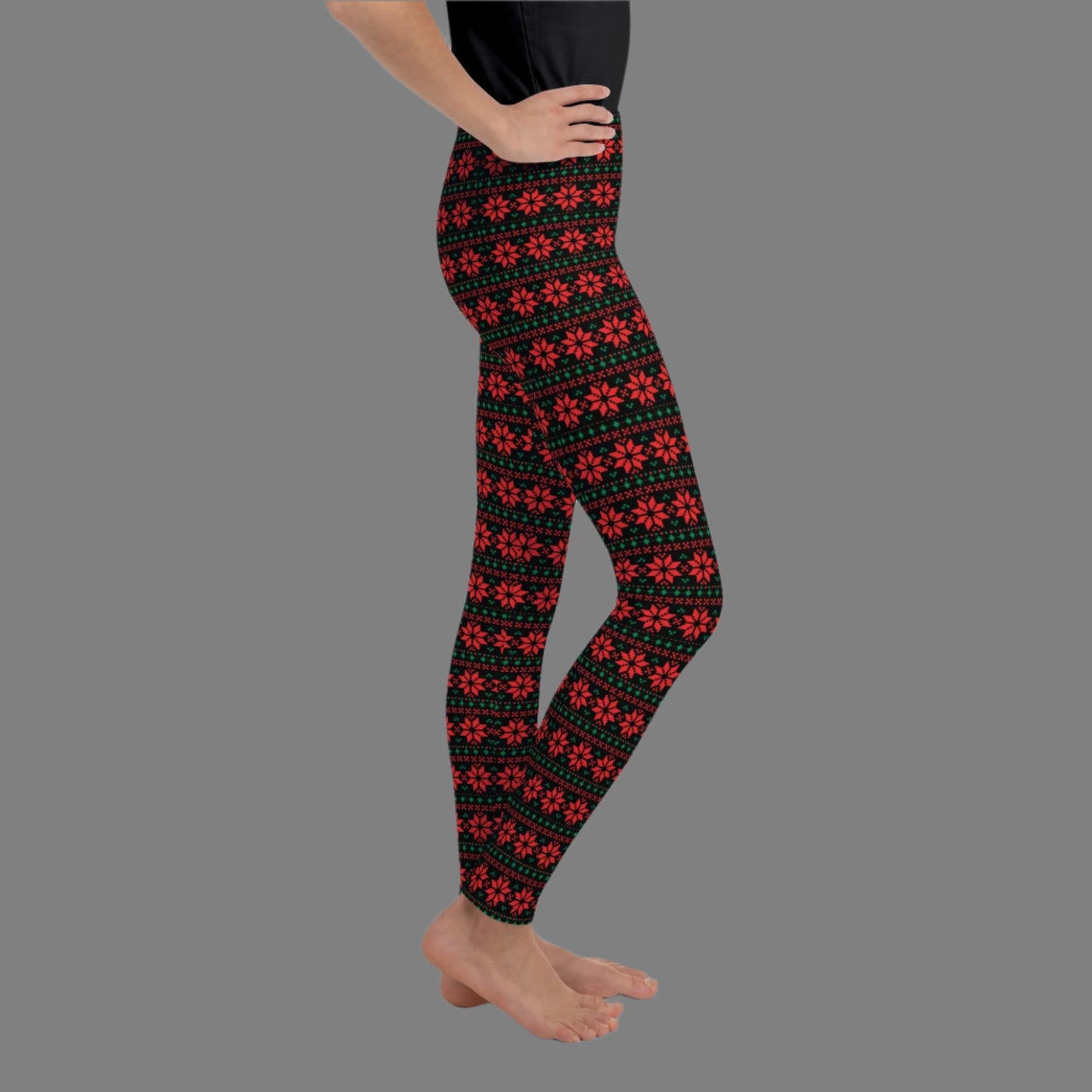 Christmas Poinsettia Toddler Leggings. Sizes 8, 10, 12, 14, 16, 18 and 20. Black leggings with an ugly sweater red and green poinsettia holiday pattern, by jaecrece