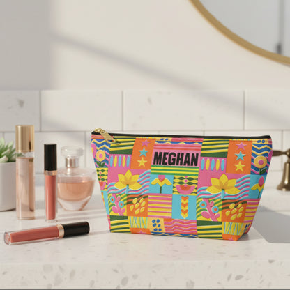 Colorful personalized cosmetic pouch featuring a vibrant mix of retro flowers, geometric shapes, stripes, and playful patterns. A custom name adds a personal touch to this cheerful makeup bag, making it a fun choice for organizing cosmetics, toiletries, beauty essentials, or small personal items. The bright eclectic design is especially suited to tweens and teens who love colorful accessories.