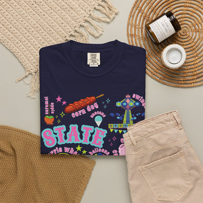 A playful carnival and state fair graphic fills the front of a Comfort Colors 1717 T shirt, combining Ferris wheel and roller coaster illustrations with cotton candy, corn dogs, funnel cake, balloons, livestock, a blue ribbon and ticket stubs in a nostalgic colorful summer fair palette with nostalgic details.
