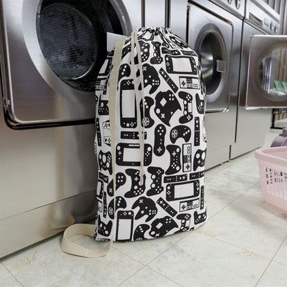 Laundry bag with gaming controller pattern in front of a washing machine in a laundry room.
