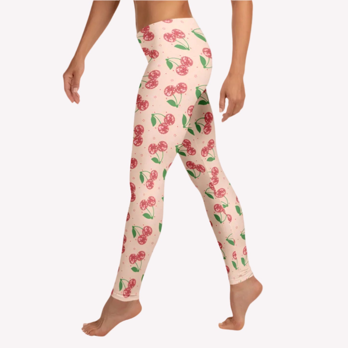 Retro inspired disco cherries leggings for women with vibrant pink background and sparkling disco ball cherry print, full length leggings with a mid rise waist perfect for athleisure wear, casual outfits, travel days, lounge style, and cherry aesthetic fashion lovers