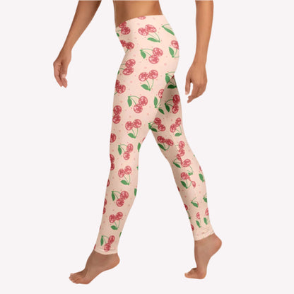 Retro inspired disco cherries leggings for women with vibrant pink background and sparkling disco ball cherry print, full length leggings with a mid rise waist perfect for athleisure wear, casual outfits, travel days, lounge style, and cherry aesthetic fashion lovers
