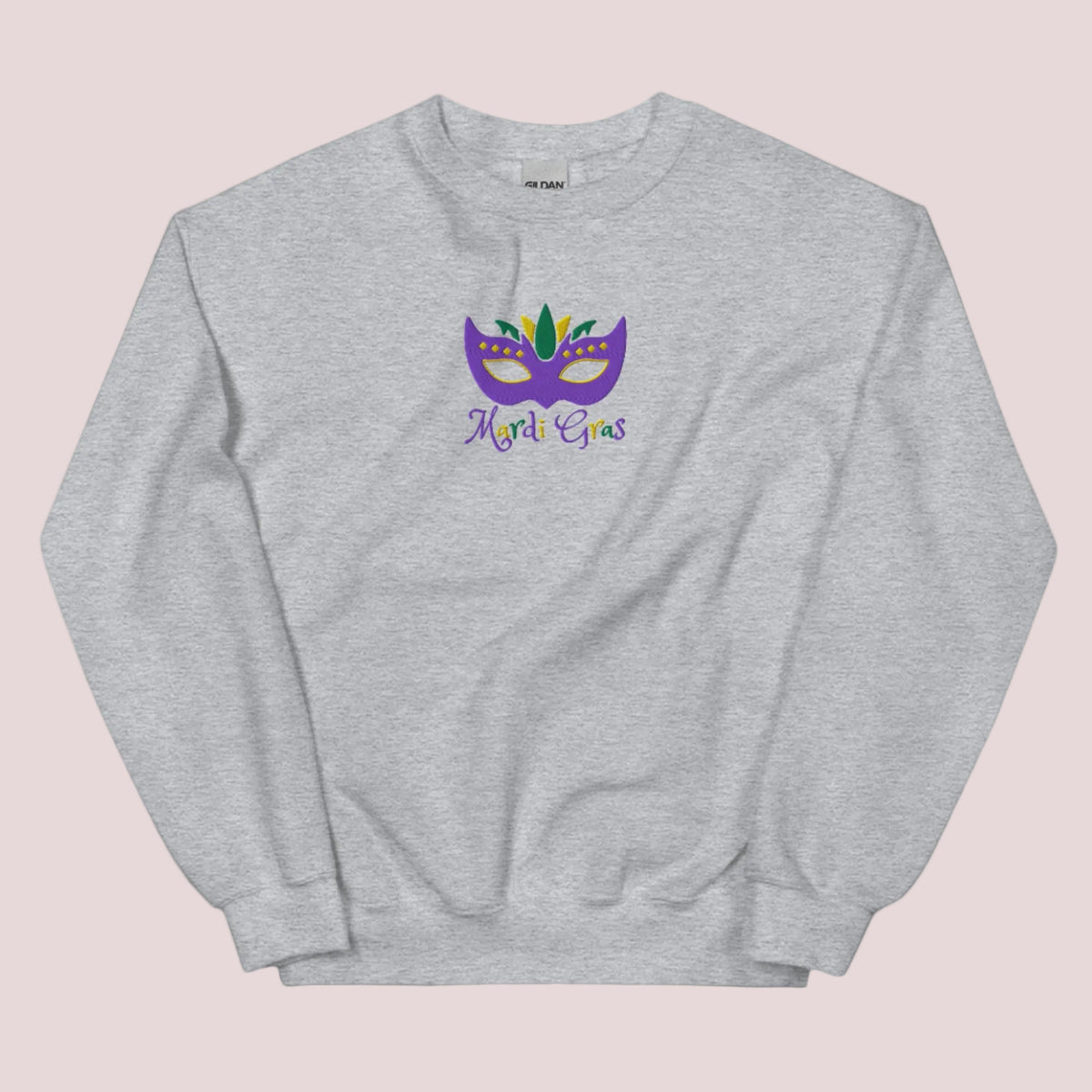 From Bourbon Street to backyard celebrations, this adult Mardi Gras sweatshirt (S–5XL) captures the magic of Carnival with a bold embroidered mask and “Mardi Gras” lettering. It’s perfect for New Orleans travel, French Quarter photos, and NOLA-themed events. Designed to coordinate with matching kids’ styles for festive, family-friendly fashion.