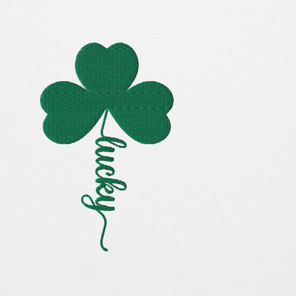 Close up detail of the embroidered shamrock design on the St. Patrick's Day sweatshirt showing the green four leaf clover with the word Lucky stitched into the stem.