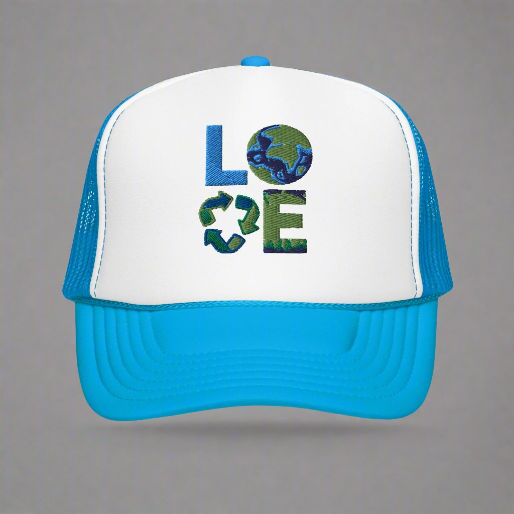 LOVE Earth Day Foam Trucker Hat, which features the letters L-O-V-E in large embroidered block letters in shades of blue and green. The hat is teal and white. The letters each represent water, earth, recycling and nature. by jaecrece.com